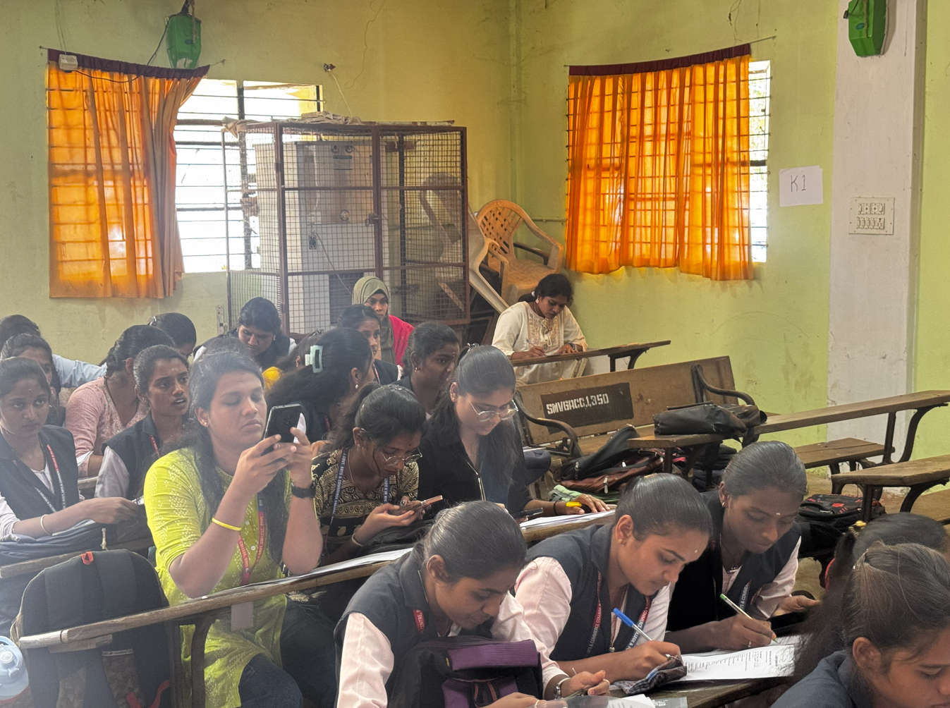 Full hall view of students attending